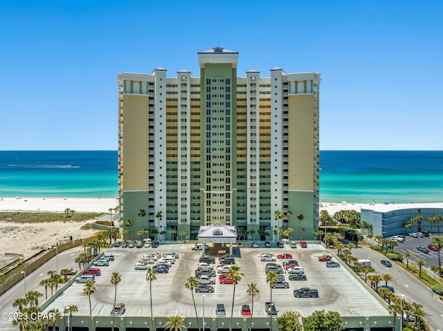 exterior space featuring a water view and a view of the beach