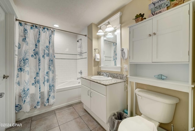 full bathroom featuring tile patterned floors, vanity, toilet, and shower / bath combo with shower curtain