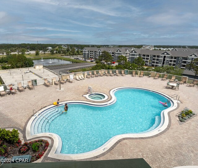 view of pool with a water view