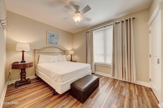 bedroom featuring hardwood / wood-style flooring and ceiling fan