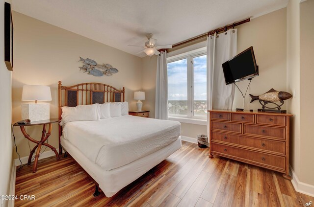 bedroom featuring hardwood / wood-style flooring and ceiling fan