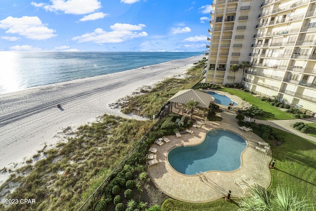 exterior space with a beach view and a water view