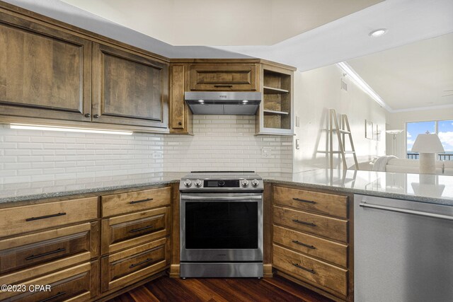 kitchen featuring appliances with stainless steel finishes, light stone counters, crown molding, and dark hardwood / wood-style flooring