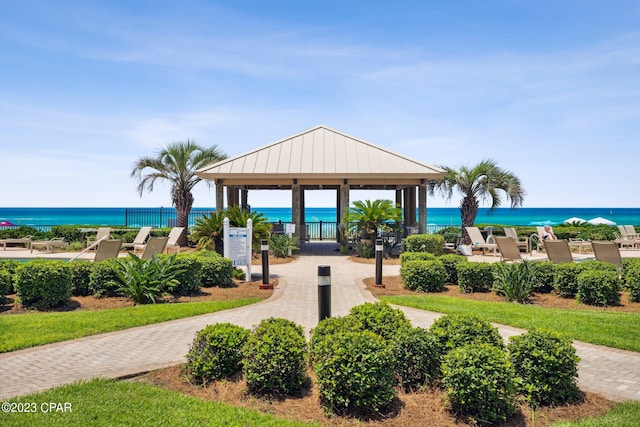 view of property's community with a gazebo and a water view