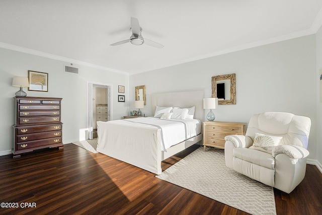 bedroom featuring hardwood / wood-style flooring, ornamental molding, and ceiling fan