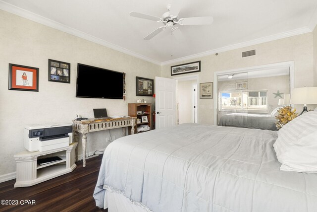 bedroom with ceiling fan, dark hardwood / wood-style flooring, and ornamental molding