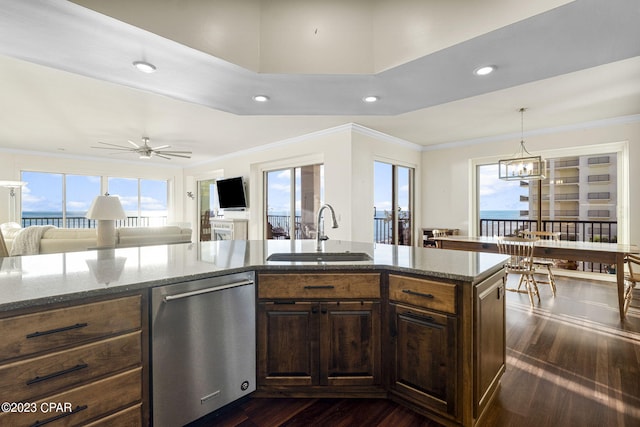 kitchen featuring sink, dark hardwood / wood-style flooring, dark stone countertops, and dishwasher