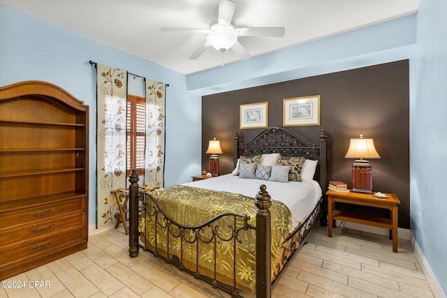 bedroom featuring ceiling fan and light hardwood / wood-style flooring