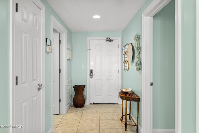 corridor featuring light tile patterned flooring