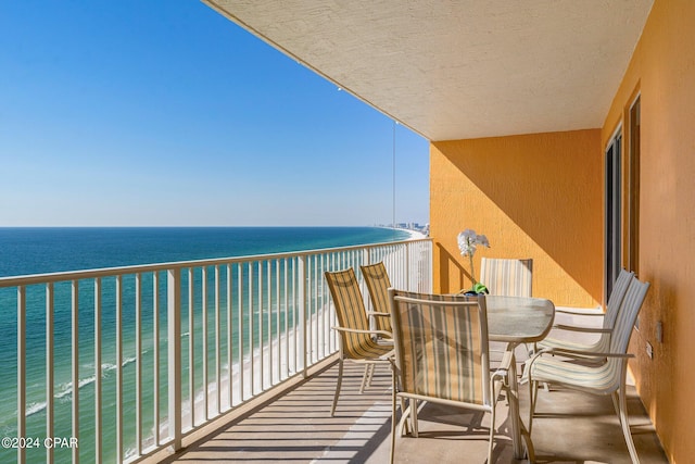 balcony with a view of the beach and a water view