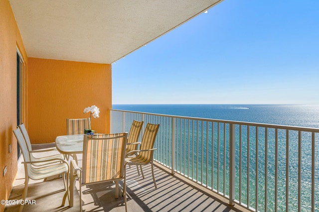 balcony featuring a water view