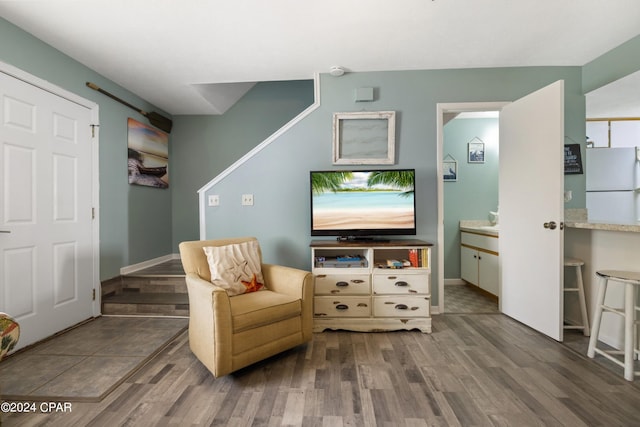 sitting room featuring dark tile floors