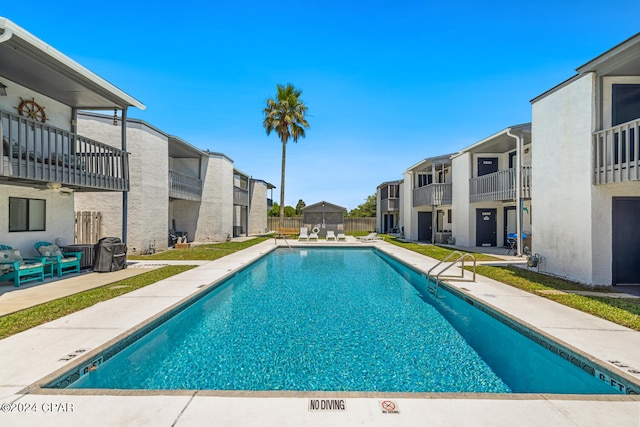 view of swimming pool with a patio