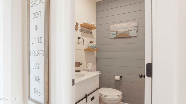 bathroom with toilet and vanity