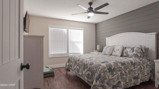 bedroom featuring ceiling fan and dark wood-type flooring