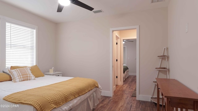 bedroom with ceiling fan and dark hardwood / wood-style flooring