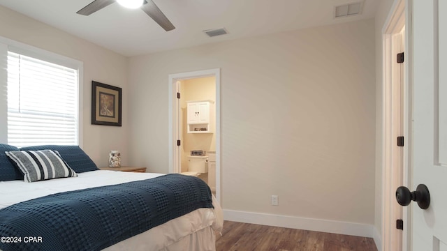 bedroom with connected bathroom, dark hardwood / wood-style floors, and ceiling fan