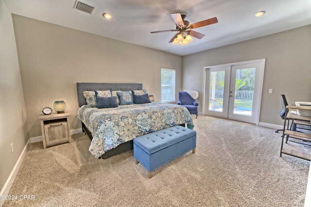 bedroom featuring light carpet, baseboards, visible vents, access to exterior, and french doors