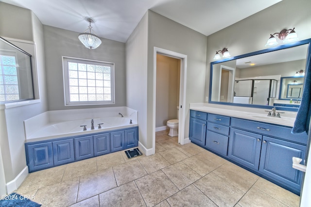 full bath with a garden tub, toilet, a shower stall, vanity, and baseboards