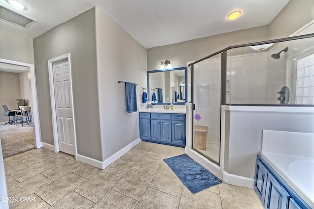 bathroom featuring a stall shower, baseboards, visible vents, and vanity