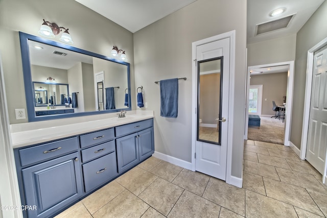 bathroom featuring vanity and tile patterned flooring