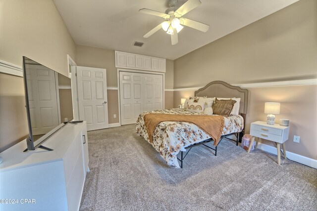 bedroom featuring light carpet and ceiling fan