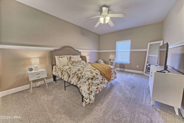 bedroom featuring ceiling fan, carpet, and baseboards