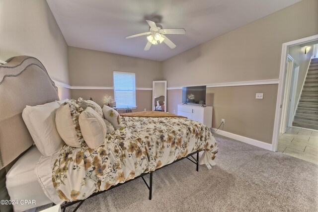 bedroom with ceiling fan and light colored carpet