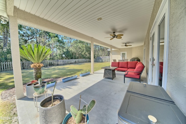 view of patio with ceiling fan, outdoor lounge area, and a fenced backyard