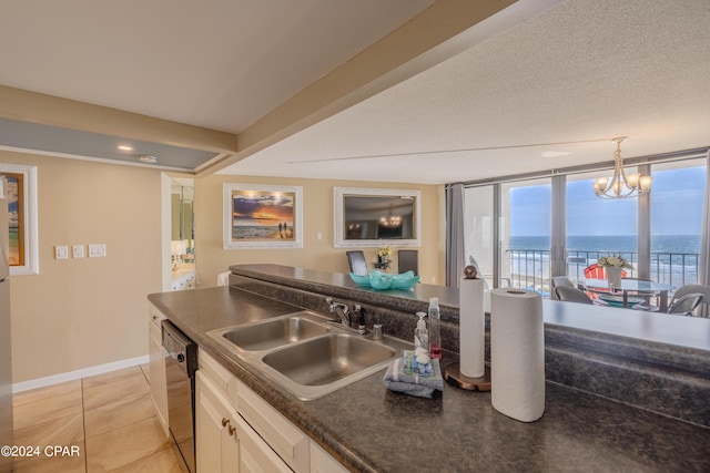 kitchen featuring a water view, black dishwasher, light tile patterned floors, sink, and white cabinetry