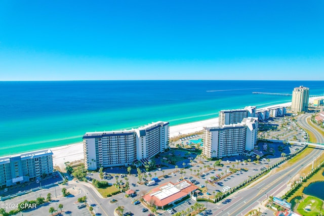 drone / aerial view featuring a water view and a beach view