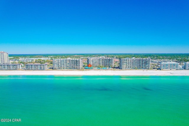 birds eye view of property featuring a water view and a view of the beach