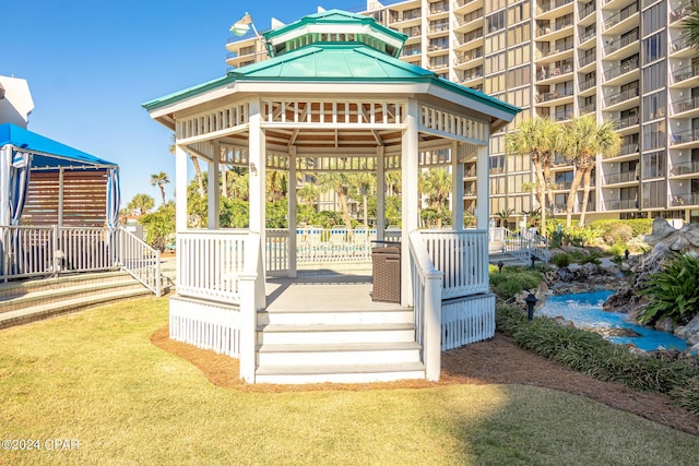 exterior space featuring a lawn and a gazebo