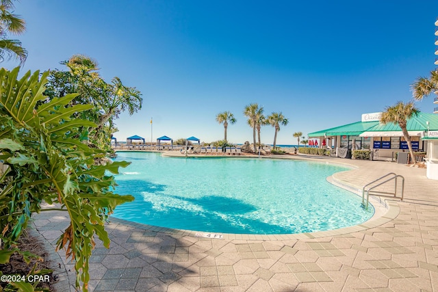 view of pool featuring a patio area