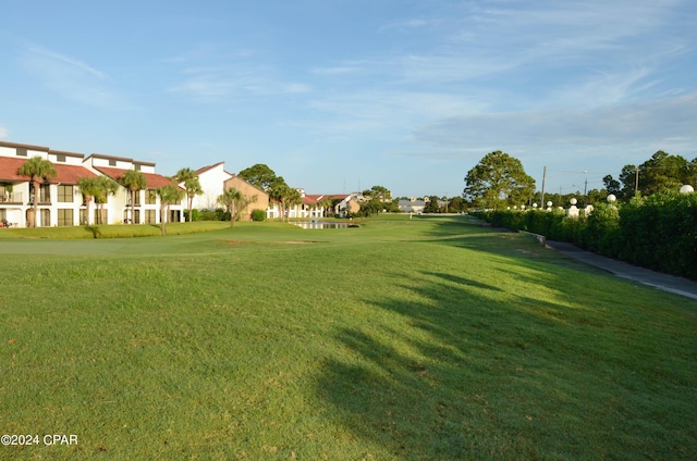 view of home's community featuring a yard