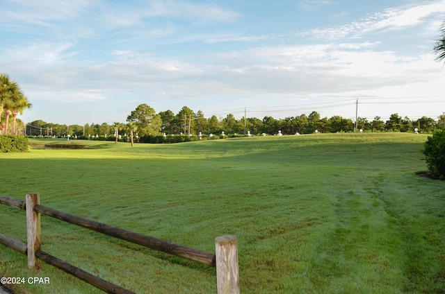 view of home's community with a lawn