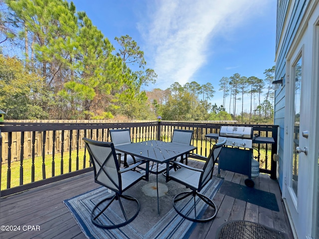 wooden terrace featuring grilling area