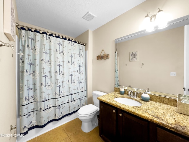 full bathroom with toilet, shower / bath combo with shower curtain, tile floors, oversized vanity, and a textured ceiling