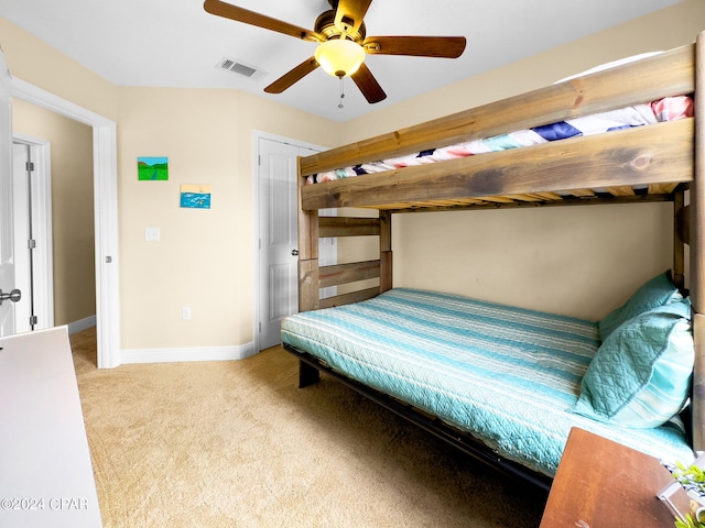 carpeted bedroom with ceiling fan