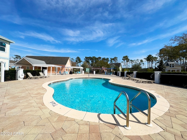 view of pool featuring a patio