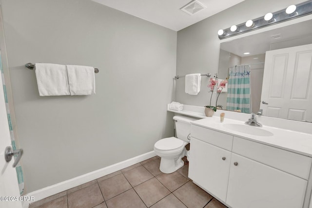 bathroom with vanity, curtained shower, tile patterned floors, and toilet