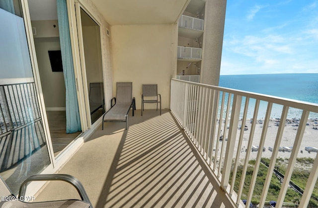 balcony with a view of the beach and a water view