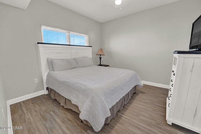 bedroom featuring hardwood / wood-style floors