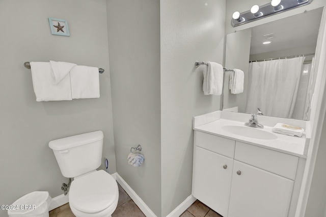 bathroom featuring tile patterned floors, vanity, toilet, and curtained shower