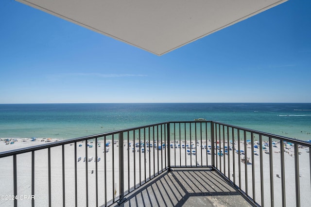 balcony with a view of the beach and a water view