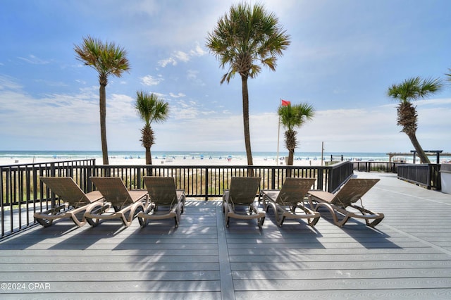 wooden deck featuring a water view