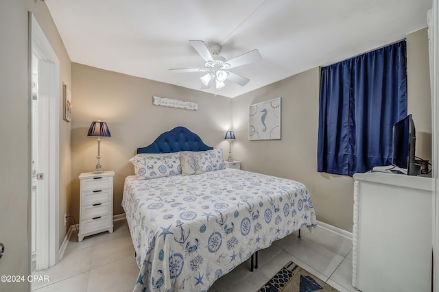 bedroom featuring ceiling fan and light tile flooring