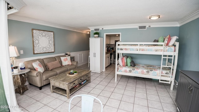 bedroom featuring ornamental molding and light tile patterned floors