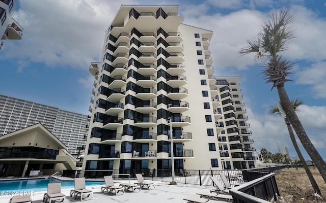 view of property with a community pool