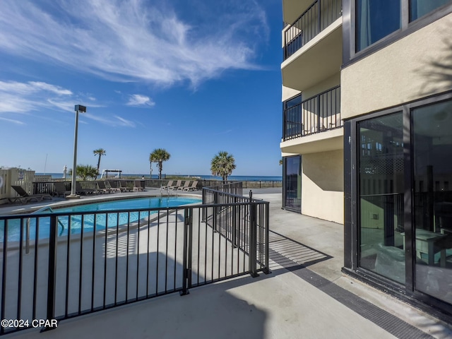 view of swimming pool featuring a patio area